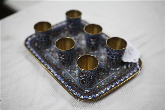 A late 19th century Russian 84 zolotnik silver gilt and cloisonne enamel liqueur set, gross 17 oz.